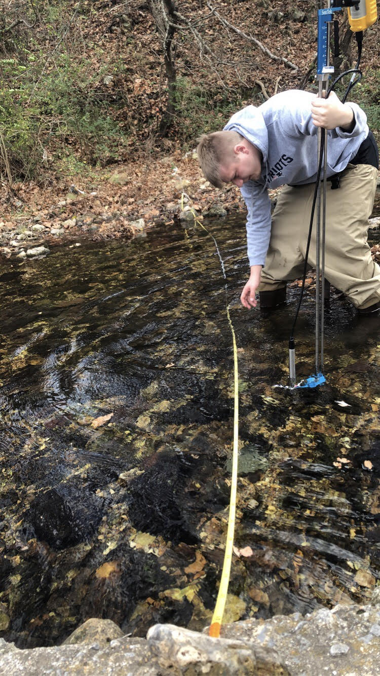 NSU students measure flow data. Photo by Julianne Perry.